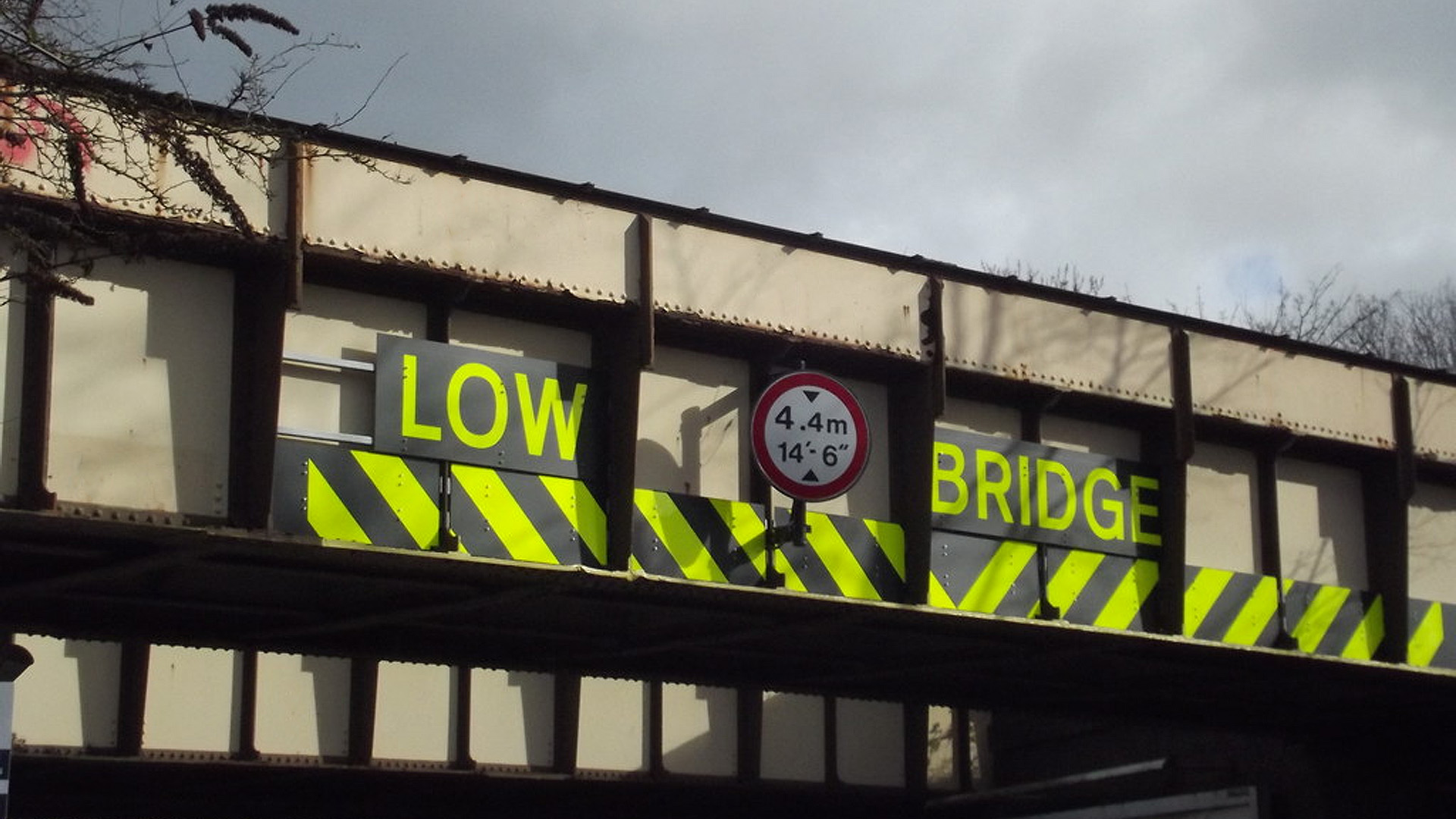 An overbridge with a large low bridge sign